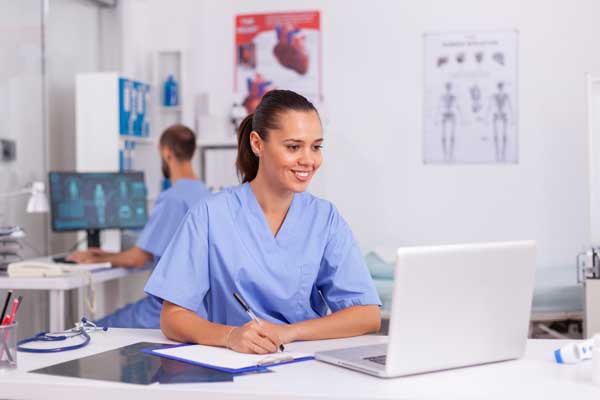 medical practitioner sitting at desk